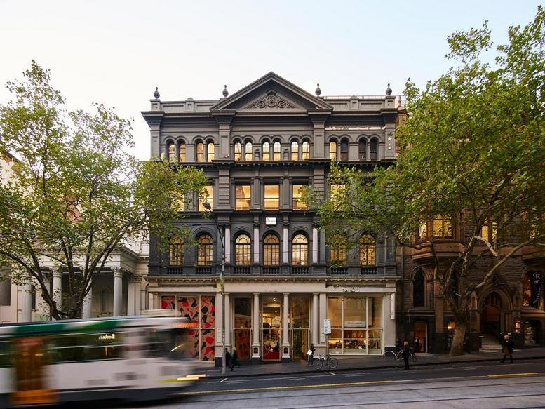 Grand historic stone facade of the heritage building at 162 Collins Street, Melbourne.