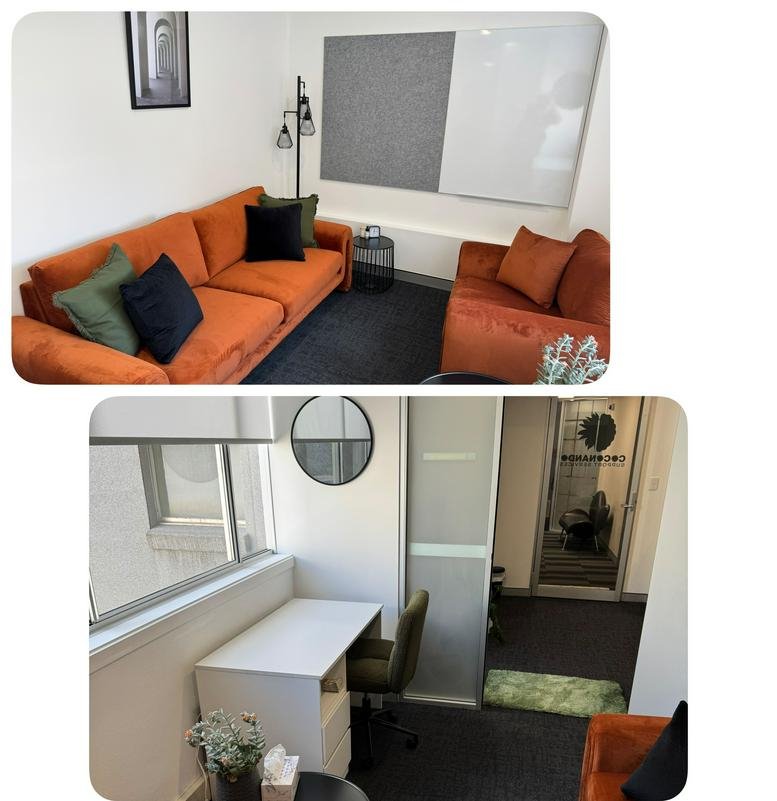 Lounge at 166 Keira Street, Wollongong CBD featuring an orange sofa and a white desk area with city views.