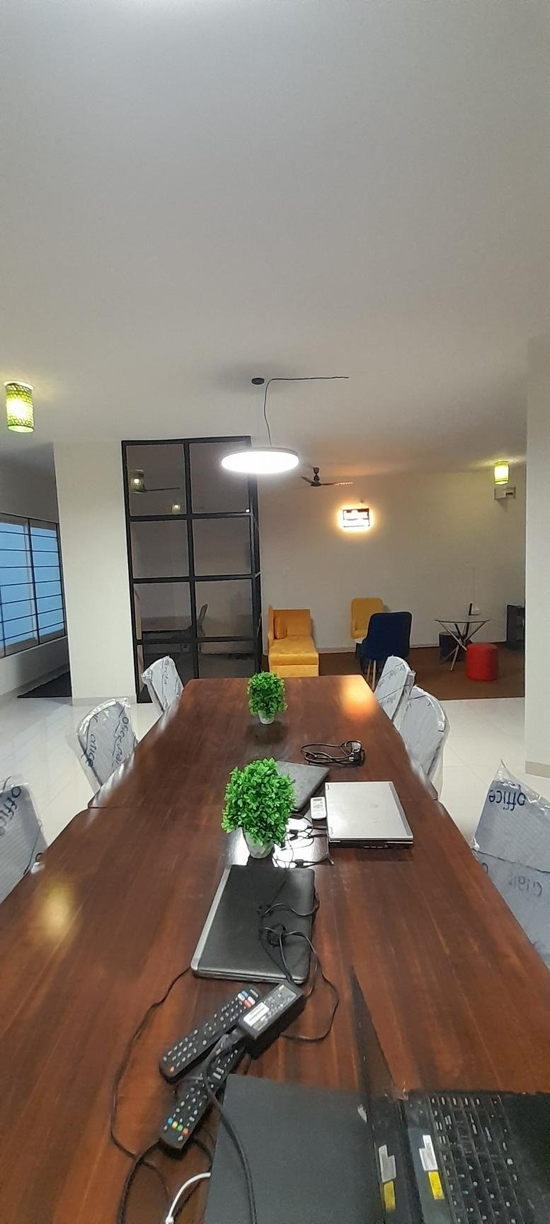 Meeting room at 17 Service Road, Vijay Udhyog Nagar, Indore, India featuring a long wooden table.