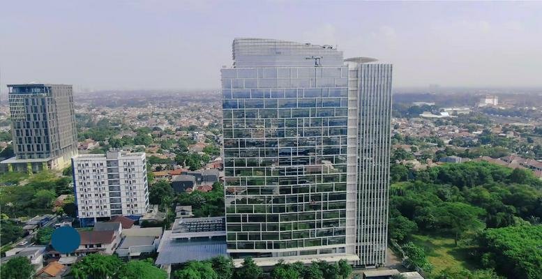 Exterior view of the office building with city landscape.
