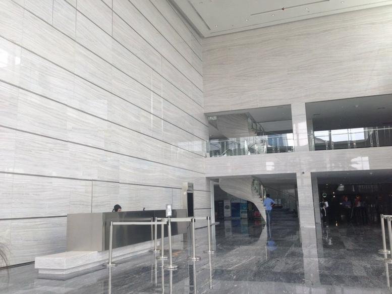 Exterior view of the modern glass-fronted skyscraper at 18 Office Park Jl TB Simatupang Kav 18.
