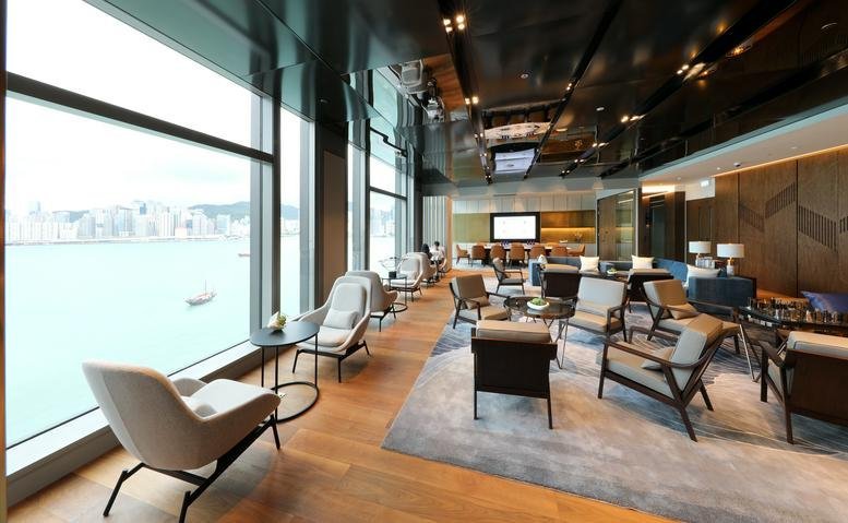 Spacious lounge at K11 Atelier, Level 7, 18 Salisbury Road with floor-to-ceiling harbor views and modern armchairs.