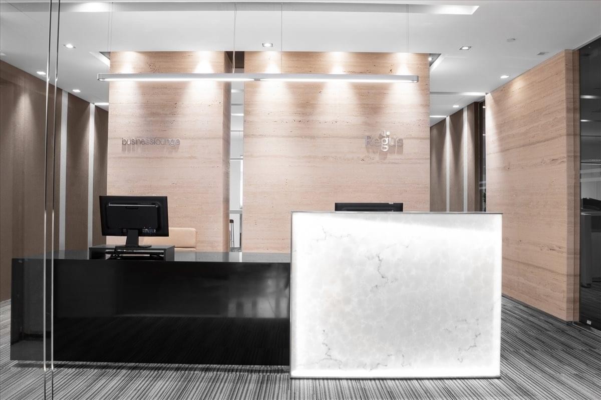 Modern reception desk with a sleek black and white counter under warm spotlighting at No. 460, Sec. 4, Xinyi Road.