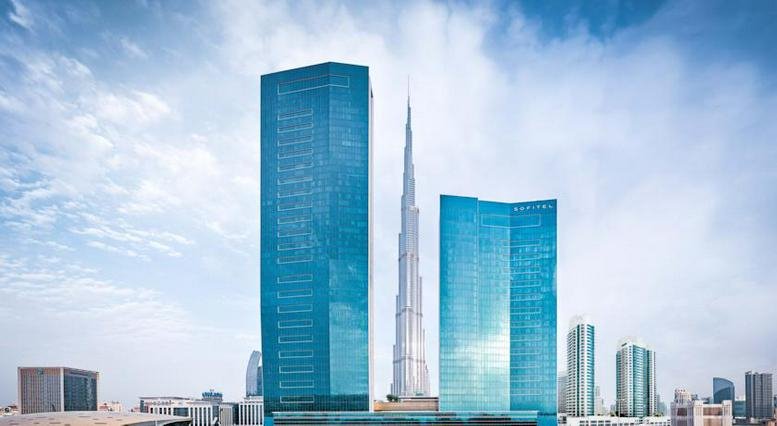 Exterior view of the sleek, glass-facade skyscrapers at 48 Burj Gate including the Burj Khalifa.