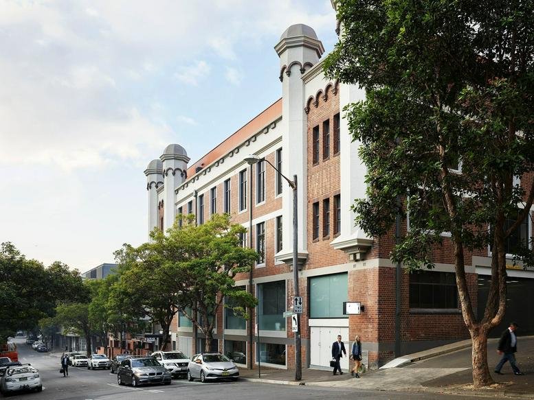 Exterior view of the historic brick building at 223 Liverpool Street, Darlinghurst.