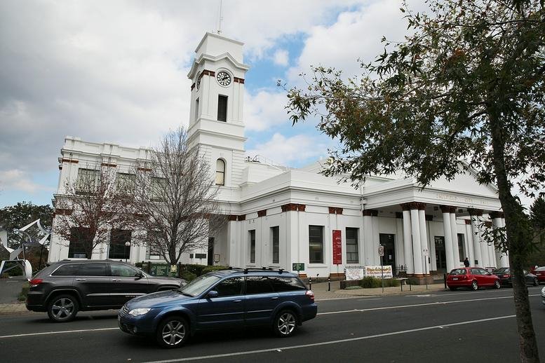 Exterior of the classic white clock tower building at 242 Hawthorn Road, Caulfield.