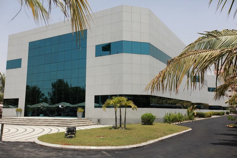 Exterior view of the contemporary white and glass building at 2556 Sultan Bin Salman.