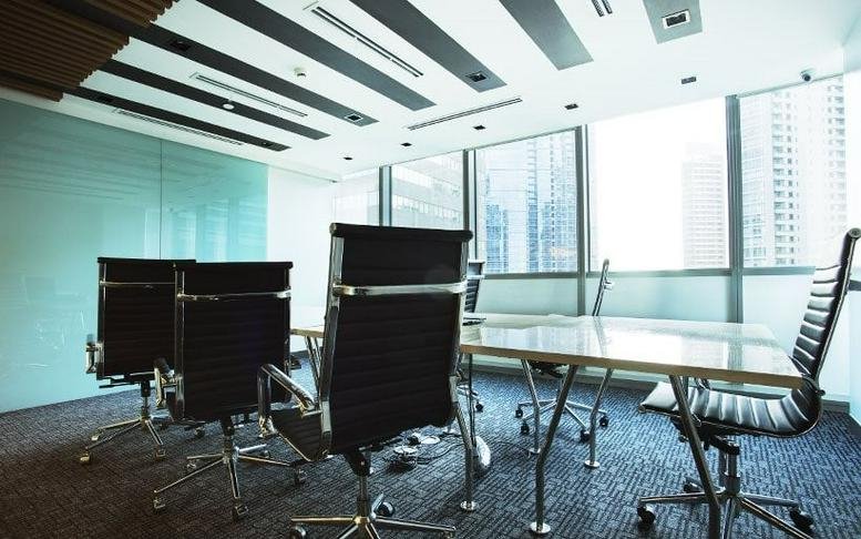 Spacious boardroom at 25th Street & 5th Avenue, Bonifacio Global City, Taguig with city skyline views.