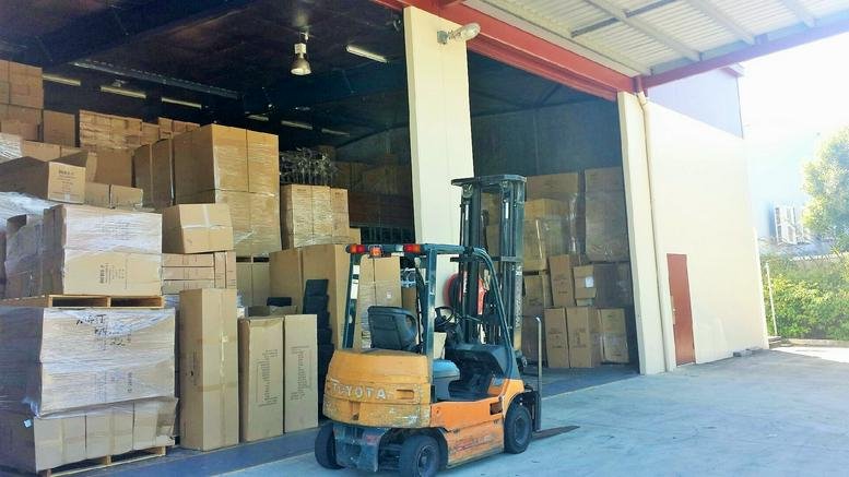 Warehouse loading bay at 3/22-24 Strathwyn St, Brendale QLD 4500 featuring a forklift and stacked boxes.