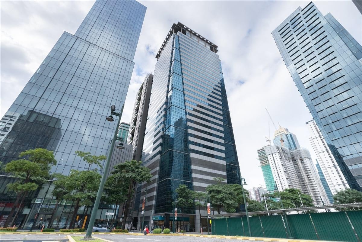 Exterior view of the glass-facade Eco Tower Building in Bonifacio Global City.