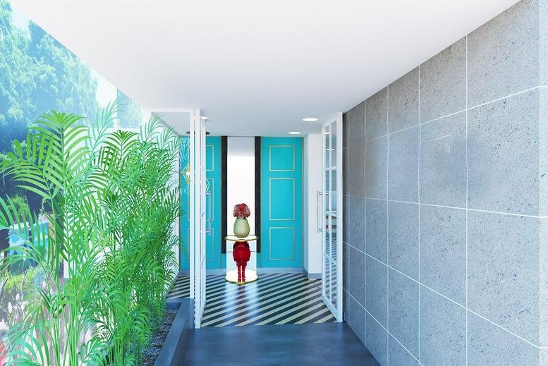 Bright entrance hallway with teal doors and a striped floor at 37, TTK road, Alwarpet, Mylapore, Chennai.