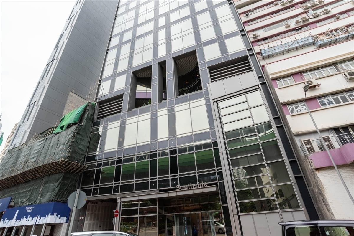 Exterior view of the modern glass and steel building at 38 Wong Chuk Hang Road.