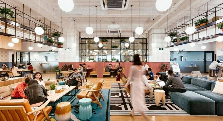 Spacious, high-ceiling communal lounge at 398 Huo Shan Lu, Yangpu District, Shanghai with diverse seating and lighting.