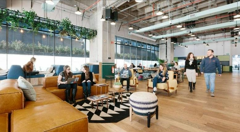 Spacious communal lounge with leather seating and high ceilings at 427 Teheran-ro, Gangnam-gu, Seoul, South Korea.