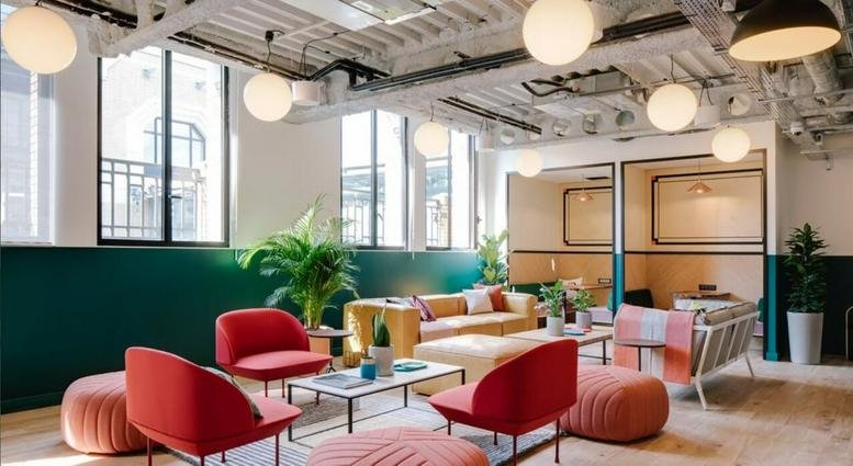 Lounge area with red chairs, velvet sofas, and potted plants at 518 Teheran-Ro, Gangnam-Gu.