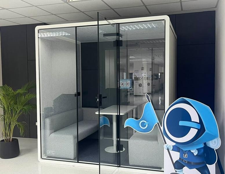 The modern glass-walled meeting pod at GameDevHub, 16th Floor, BB Building.