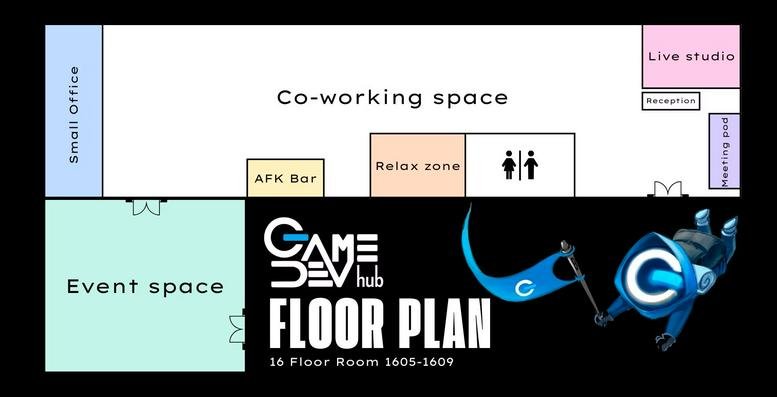 Wide-angle interior view of the GameDevHub at the BB Building with desks and city-view windows.
