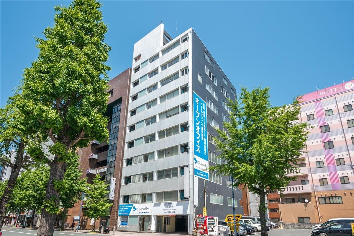 Exterior view of the Alba Ginza Dori Building under a clear blue sky.