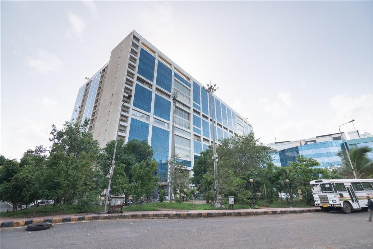 Exterior view of the glass-facade Rupa Solitaire building at Millennium Business Park.