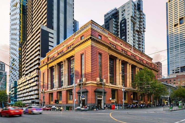 Exterior view of the historic red brick building at 673 Bourke Street, Melbourne.