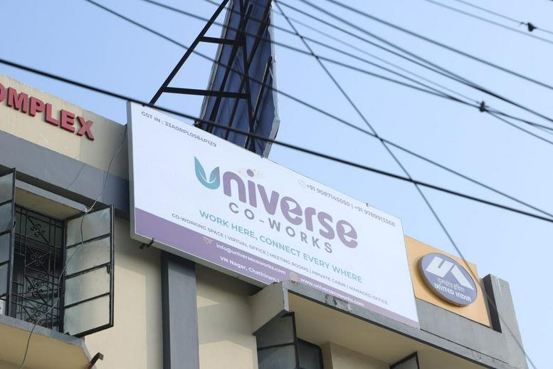 Detailed view of the building exterior signage against a clear sky.