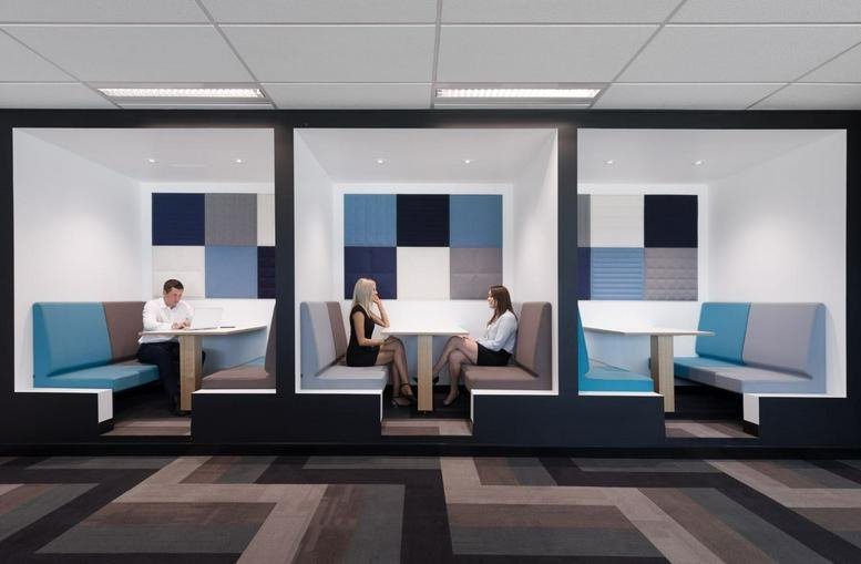 Meeting booths at Lobby 1, Level 2, 76 Skyring Terrace with acoustic wall panels and colorful seating.