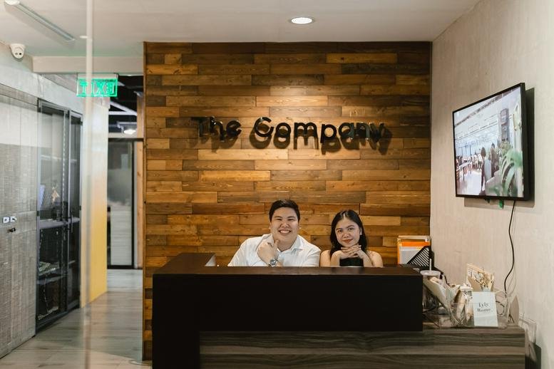 Modern reception desk at Mabuhay Tower, 6th Floor, Abad Street, Lahug, Cebu, Philippines with a wood-slat wall.