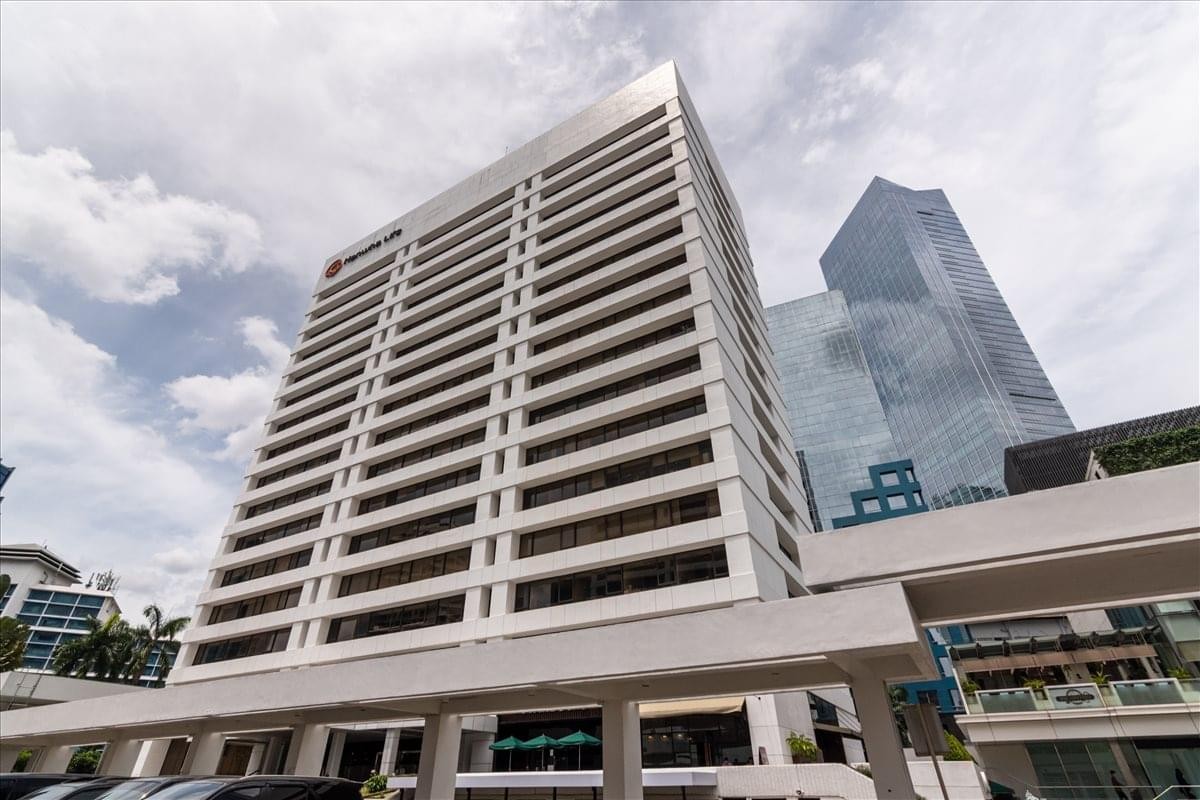 Exterior view of the white high-rise building at Jl. Jendral Sudirman Kav. 29-31.