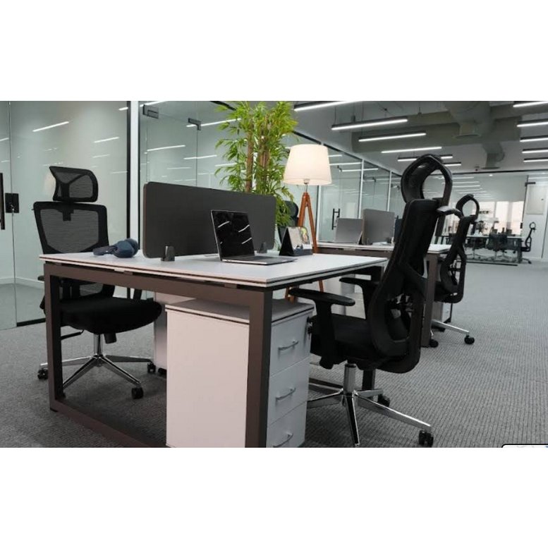 Modern open-plan workspace at Al-Hamra District - Palestine Commercial Center with ergonomic chairs and greenery.