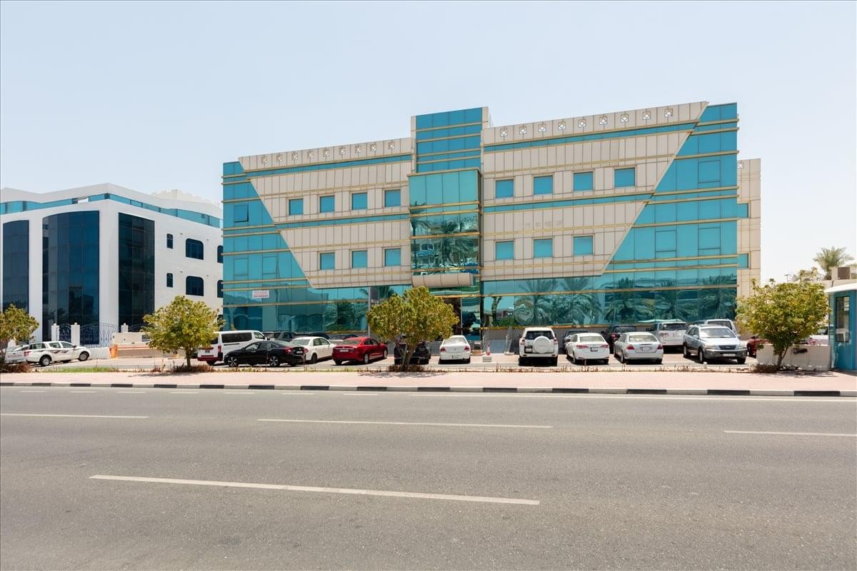 Exterior view of the glass-facade Building No. 81 at 250 D Ring Road.