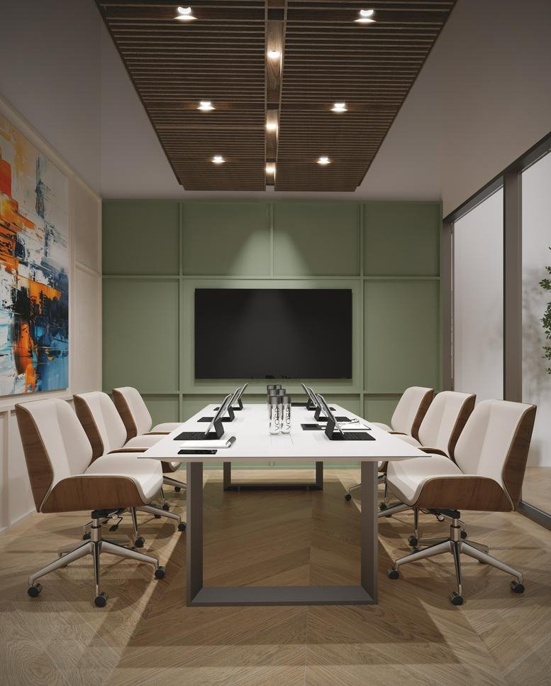 Modern conference room at Addax Tower with a long white table and olive green paneled walls.