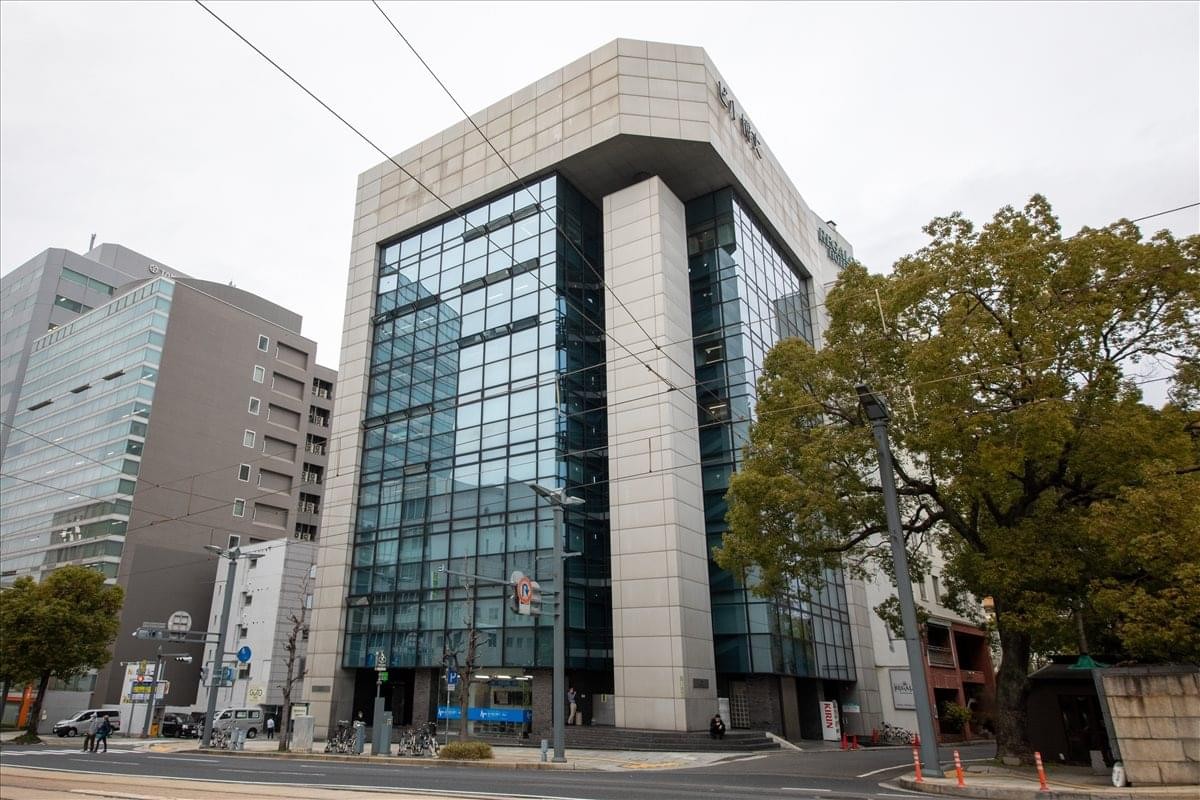 Exterior view of the glass-facade Anabuki Hiroshima Building.