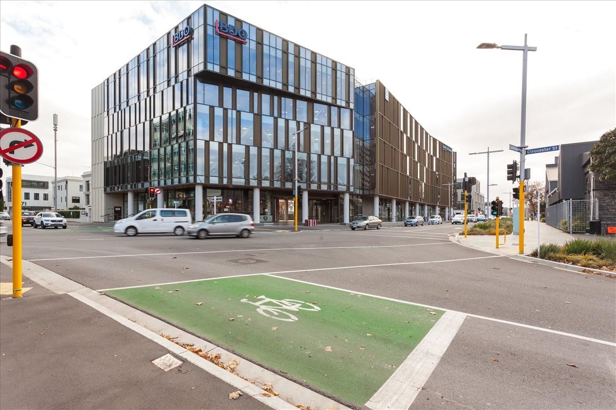 Exterior view of the contemporary glass and wood facade of the AWLY Building at 287-293 Durham Street.