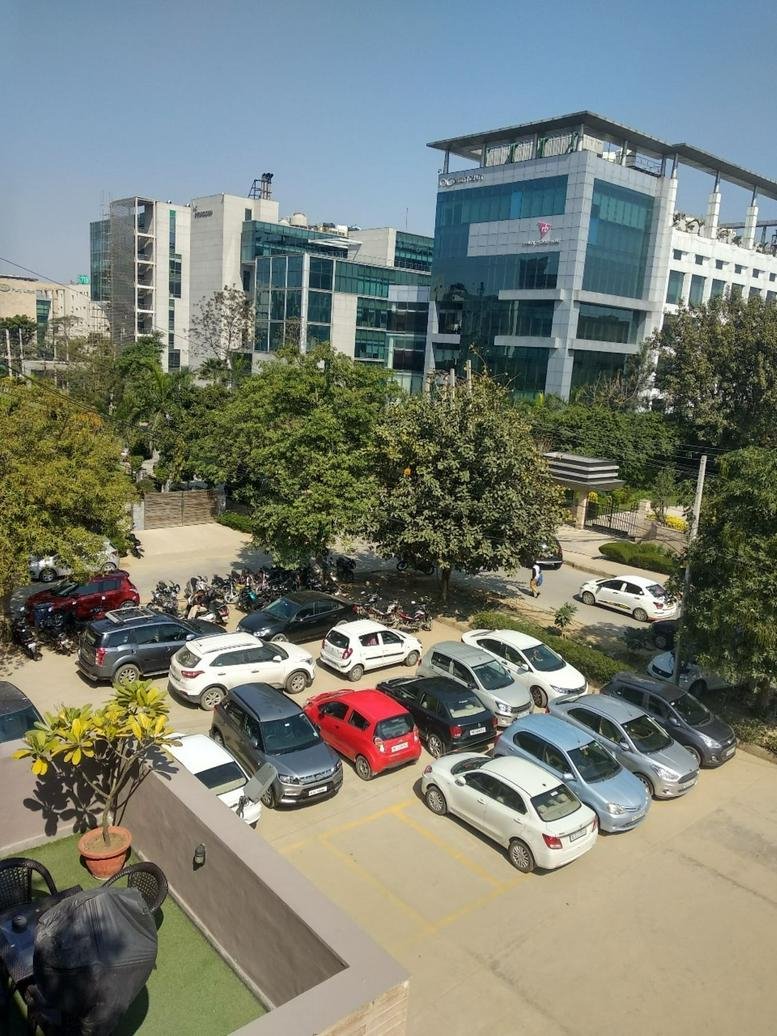 Exterior view of the glass-facade building at B17, Institutional Area, Sector 32.