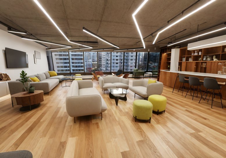 Large modern lounge with various sofas, armchairs, and stylish geometric ceiling lighting.
