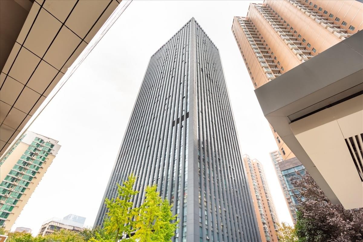 A dramatic upward angle of the glass facade skyscraper at Boss Will, No. 1268 Jinghan Avenue.