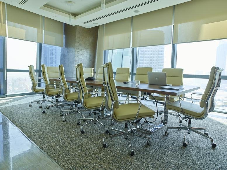 Grand conference room at Boulevard Plaza, Tower 2, featuring floor-to-ceiling windows and leather seating.