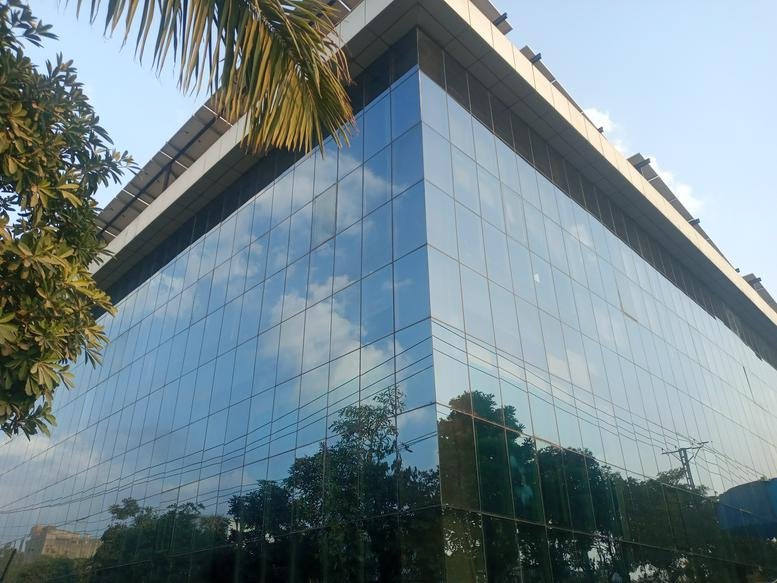Exterior view of the glass-facade Building No. 308, Street 3, I-9/3, Islamabad, Pakistan.