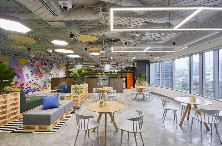 Lounge area with modular seating and mural at Capital Tower, Floors 9-11, 87/1 Wireless Road, Bangkok, Thailand.