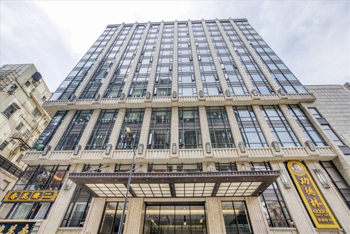 Low-angle exterior view of the multi-story Carlton Building facade.