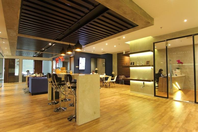 Spacious modern lobby at Centennial Tower L29D with wood-slat ceilings and polished floors.