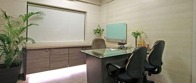 Private executive office at Chakala, Andheri, Kurla Road, Hanuman Nagar, Andheri East, Mumbai with glass desk and plant.