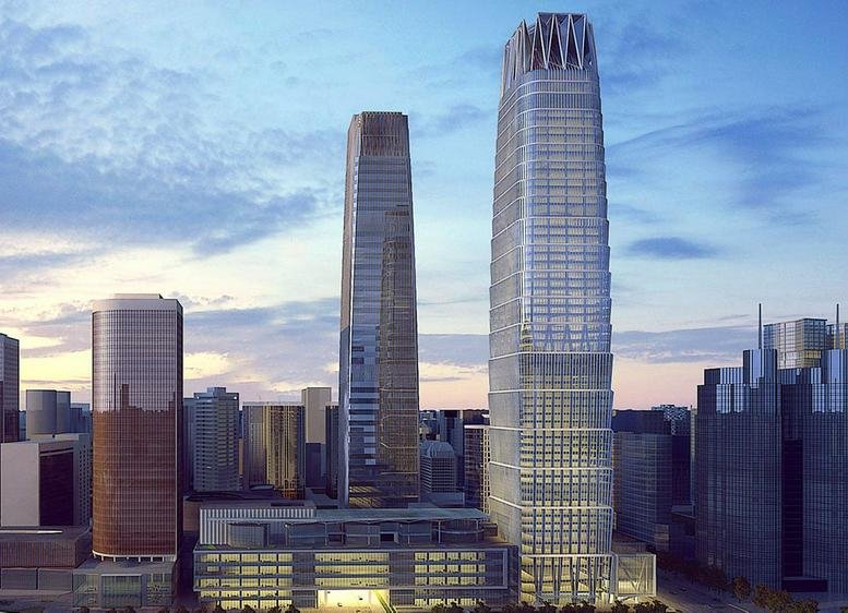 Exterior view of the glass-facade China World Tower B and surrounding skyscrapers.