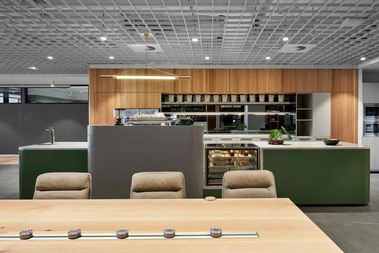 Modern communal kitchen and cafe area at Collins Square Tower 5, 727 Collins Street.