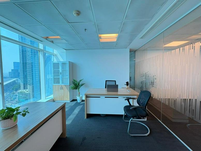 Spacious corner office with floor-to-ceiling windows and views of the Conference Centre, West Bay, Doha, Qatar.
