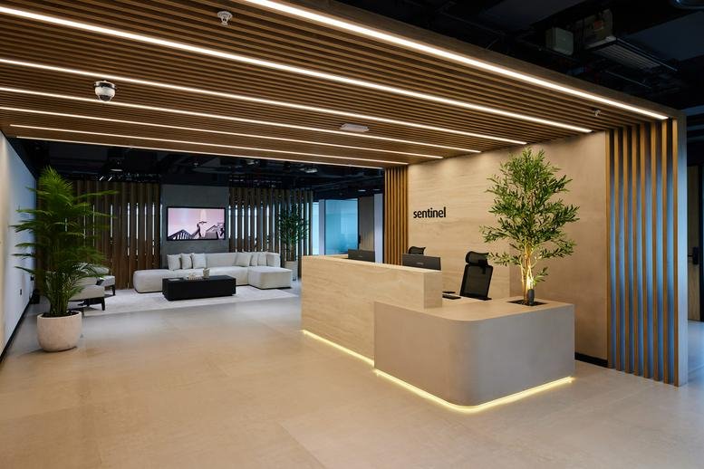 Spacious reception area with a wooden slat ceiling at Convention Tower.