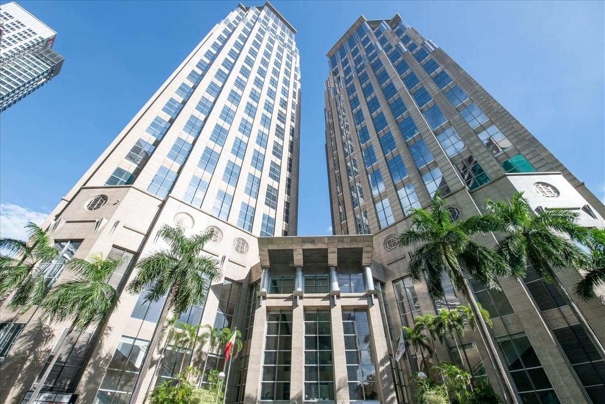 Low-angle exterior view of the twin skyscrapers at Tower 2, 28th Floor, Ayala Avenue.