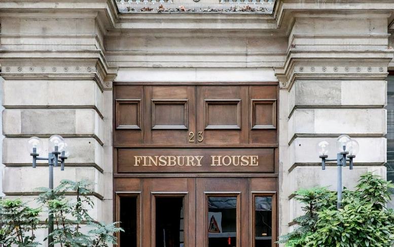 Stone facade and grand wooden entrance of DBS House, 31 Prescot Road, Fort, Mumbai.