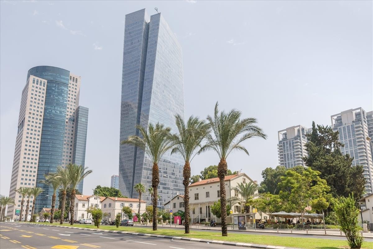 Exterior view of the towering glass skyscraper at Derech Menachem Begin 121-123.