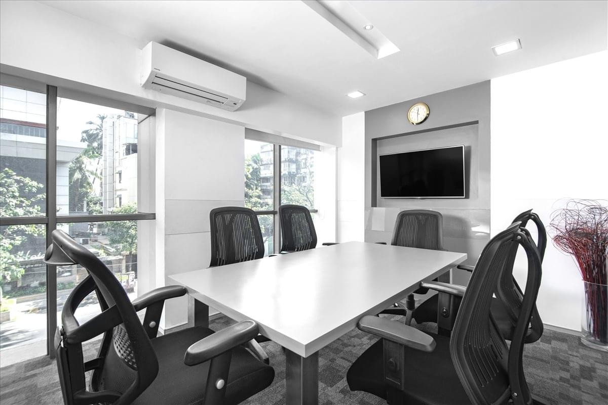 Professional meeting room at Duru House, 2nd/ 3rd/ 4th floors with a long white table and city views.